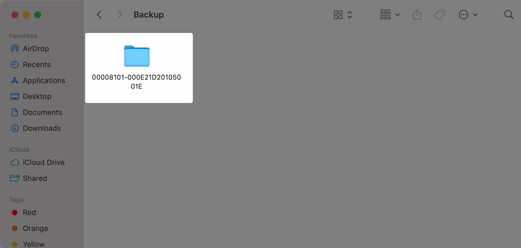 Choosing the iPhone backup folder to delete in Finder on a Mac
